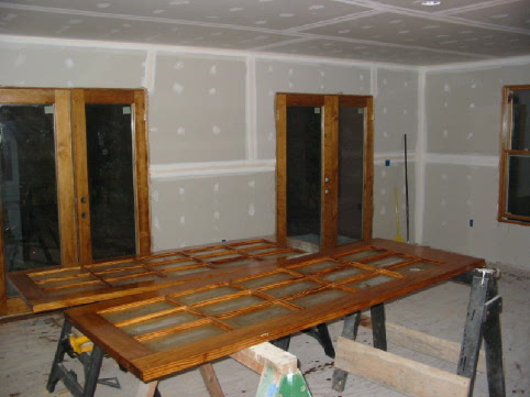 Randy began staining the Great Room windows and doors.
